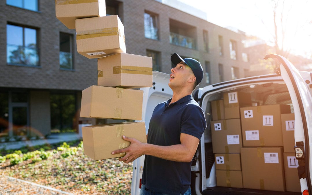 Delivery man dropping boxes